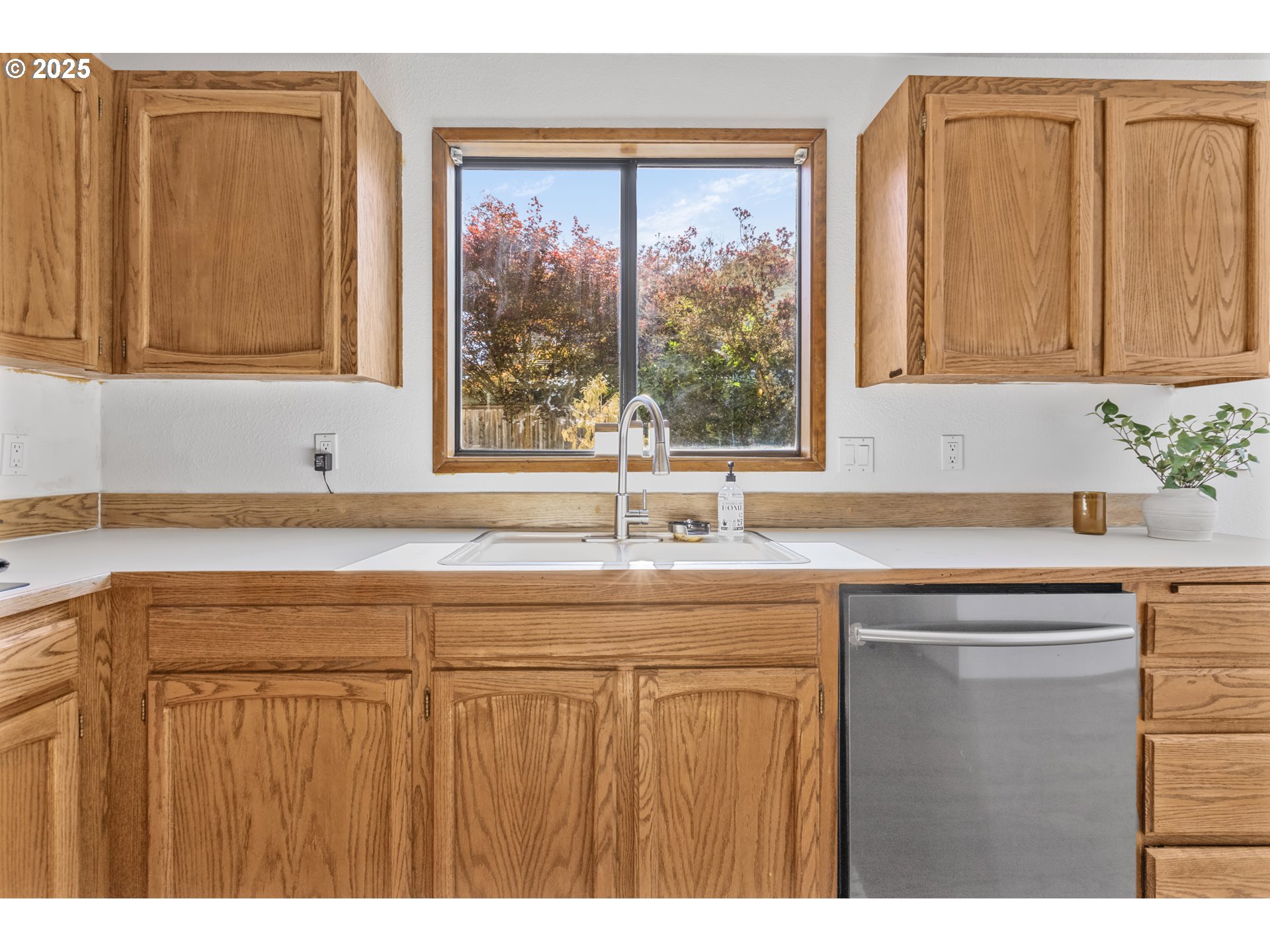 2641 Northwest Crocker Lane Albany, OR 97321 - Photo 19 of 47 a kitchen with a sink a window and cabinets