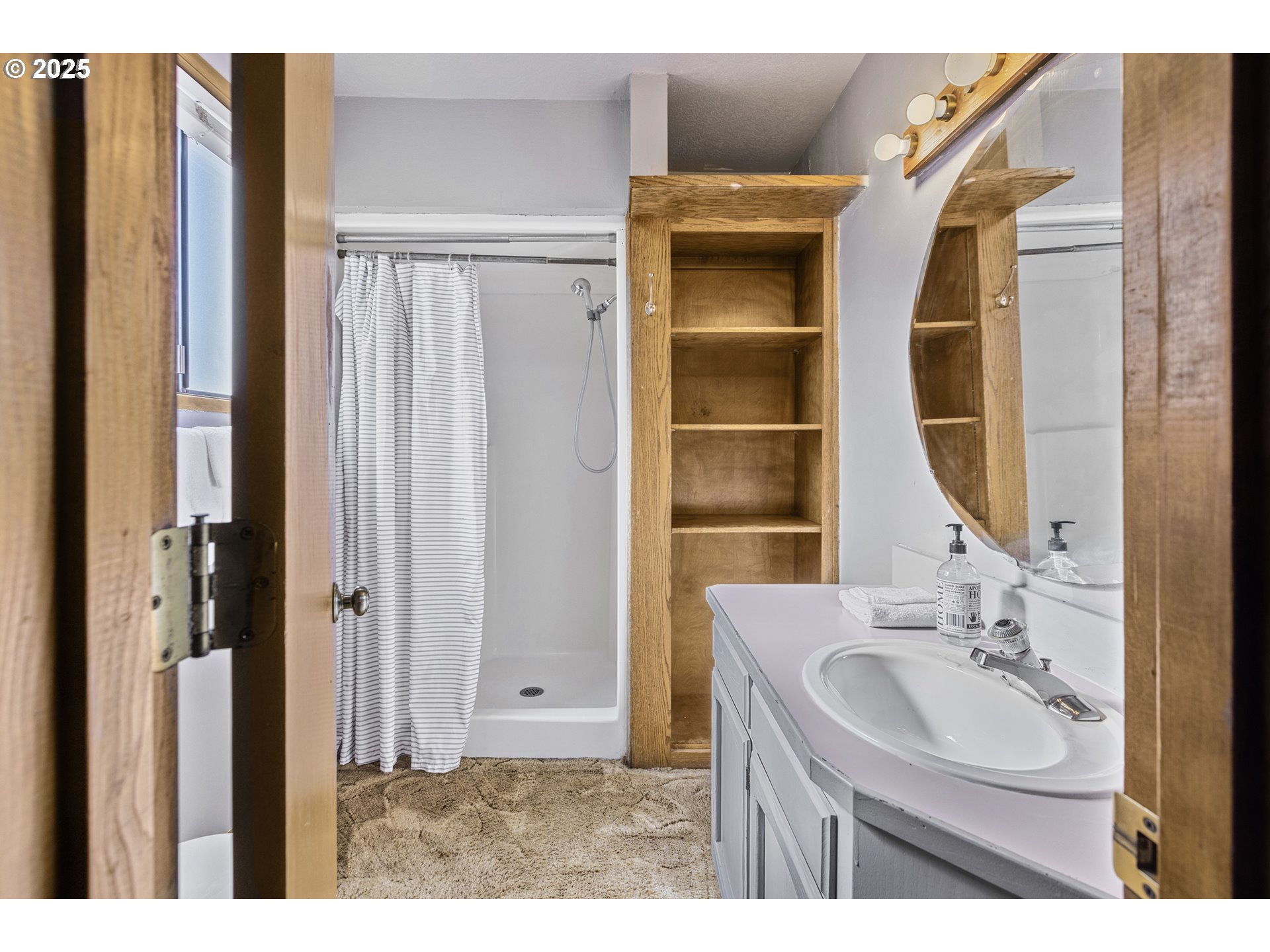 2641 Northwest Crocker Lane Albany, OR 97321 - Photo 28 of 47 a bathroom with a sink and a mirror