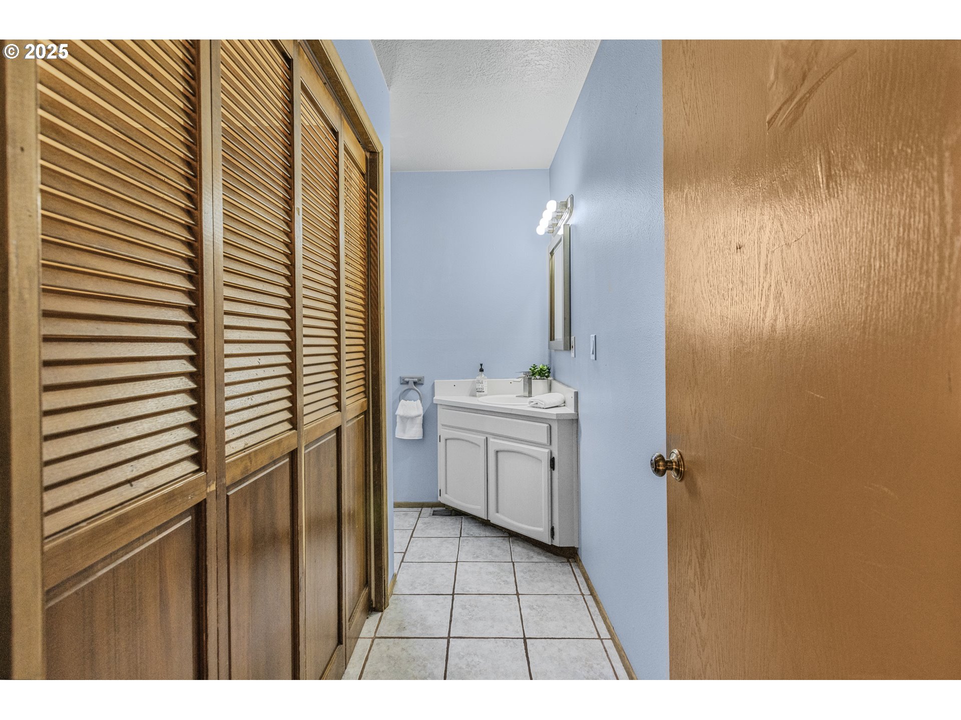 2641 Northwest Crocker Lane Albany, OR 97321 - Photo 37 of 47 a bathroom with a sink and a mirror