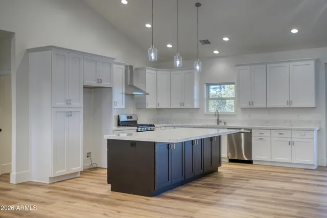 a kitchen with a sink and cabinets