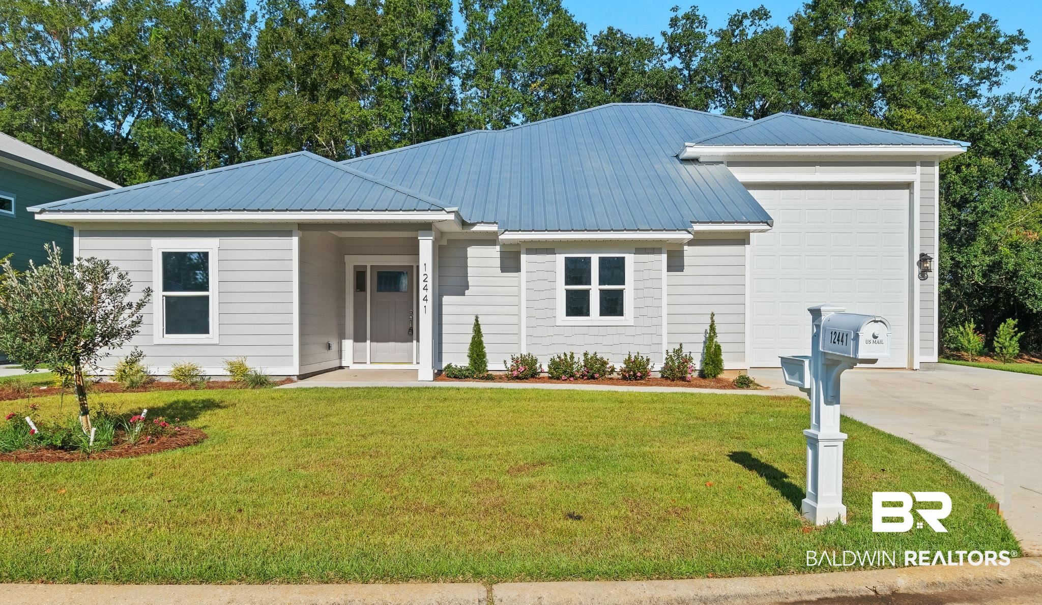 12441 Reunion Place Foley, AL 36535 - Photo 1 of 31 View of front of property featuring a front lawn and a garage