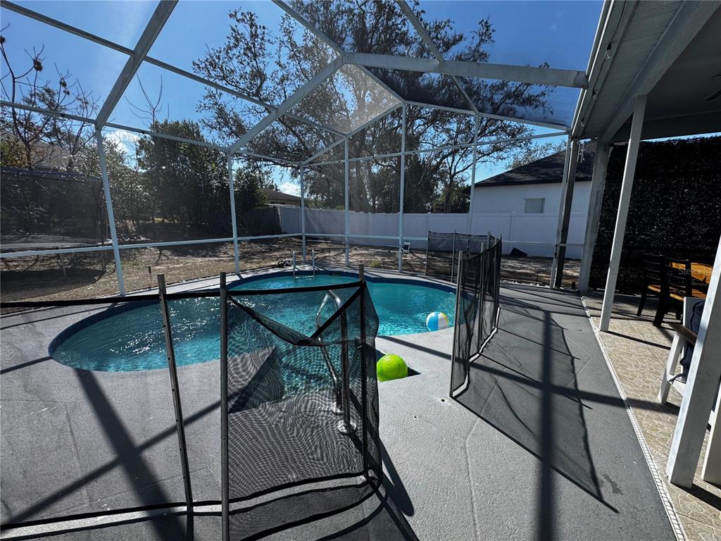 10130 Spring Hill Drive Spring Hill, FL 34608 - Photo 24 of 33 a view of a swimming pool with a patio