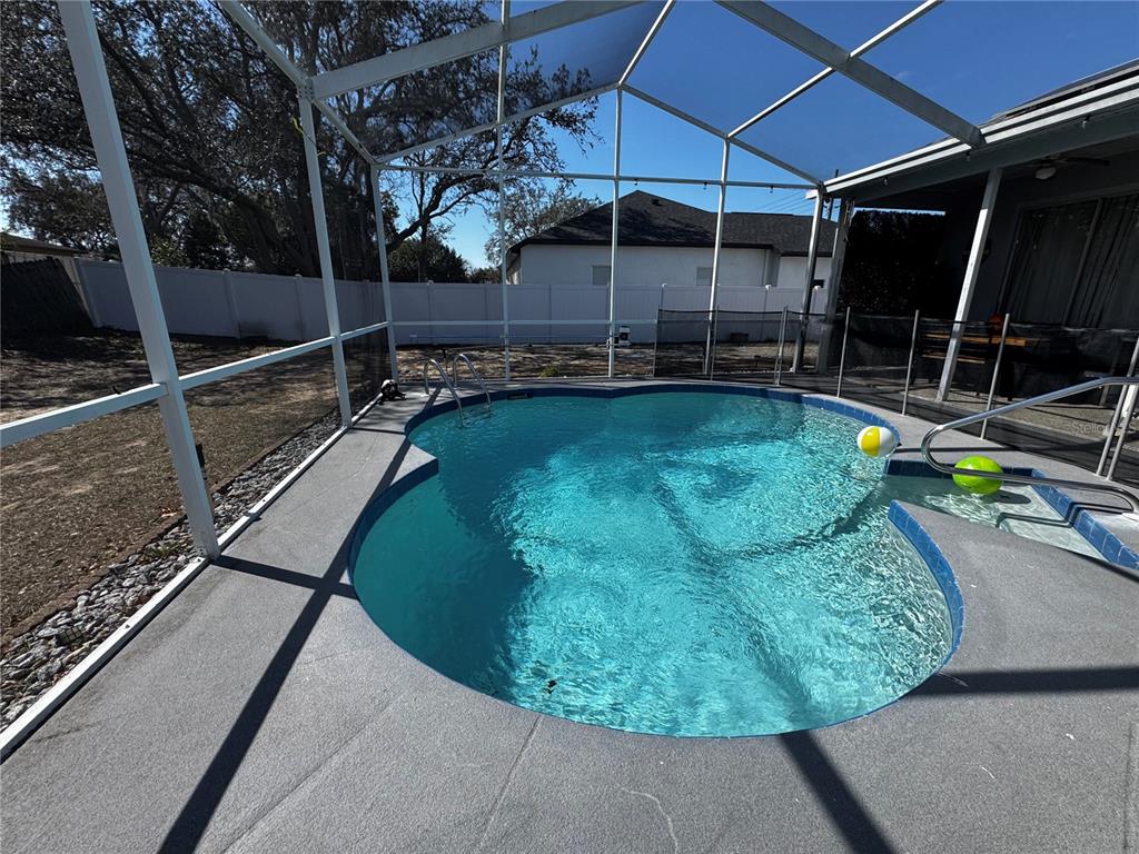 10130 Spring Hill Drive Spring Hill, FL 34608 - Photo 25 of 33 a view of a swimming pool with a patio