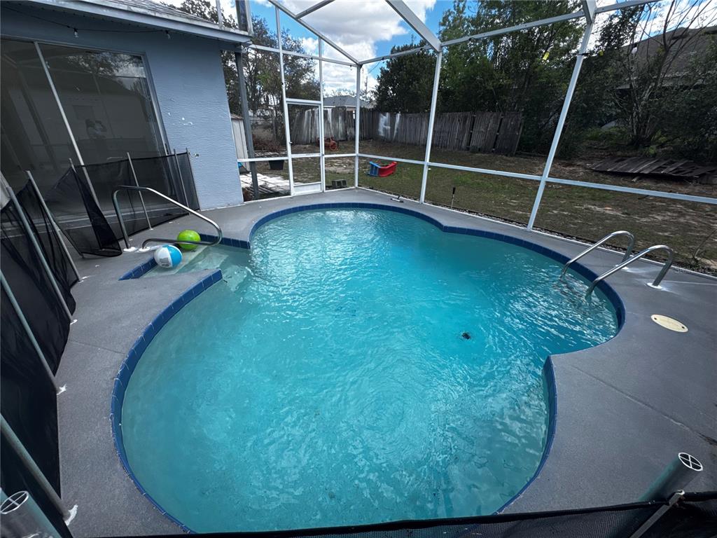 10130 Spring Hill Drive Spring Hill, FL 34608 - Photo 29 of 33 a view of swimming pool from a balcony