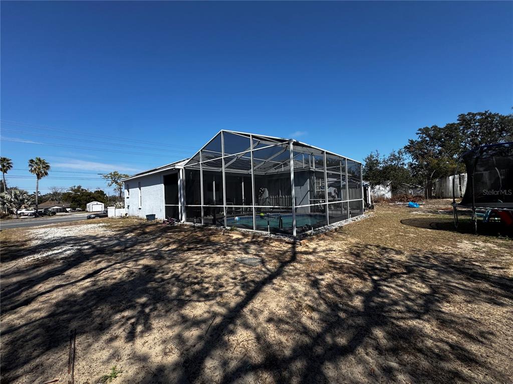 10130 Spring Hill Drive Spring Hill, FL 34608 - Photo 30 of 33 a view of a house with a yard
