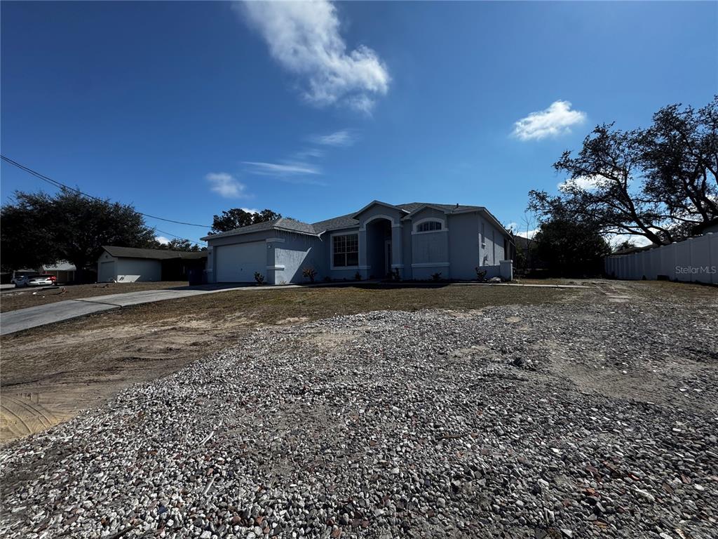 10130 Spring Hill Drive Spring Hill, FL 34608 - Photo 5 of 33 a view of a house with a yard