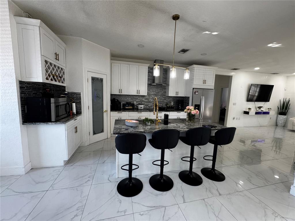 10130 Spring Hill Drive Spring Hill, FL 34608 - Photo 8 of 33 a kitchen with a counter space cabinets and appliances