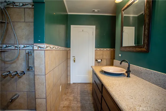 a bathroom with a sink and mirror