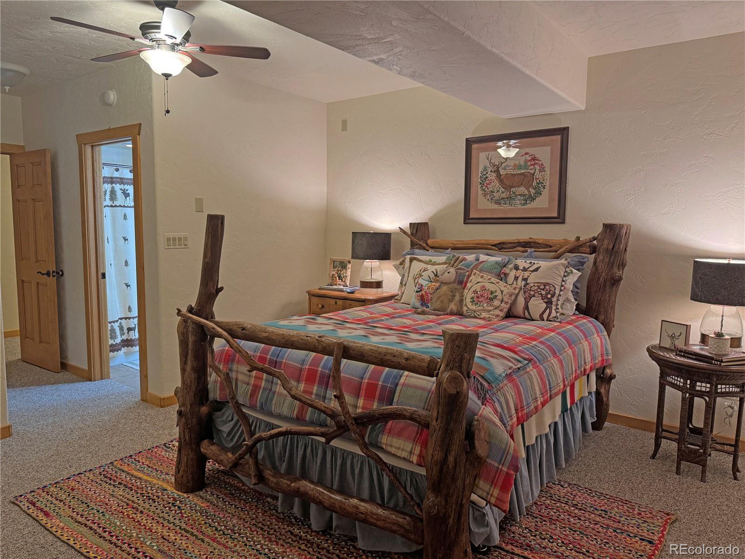 200 Moffat Road Cotopaxi, CO 81223 - Photo 11 of 42 a bedroom with a bed a mirror and furniture