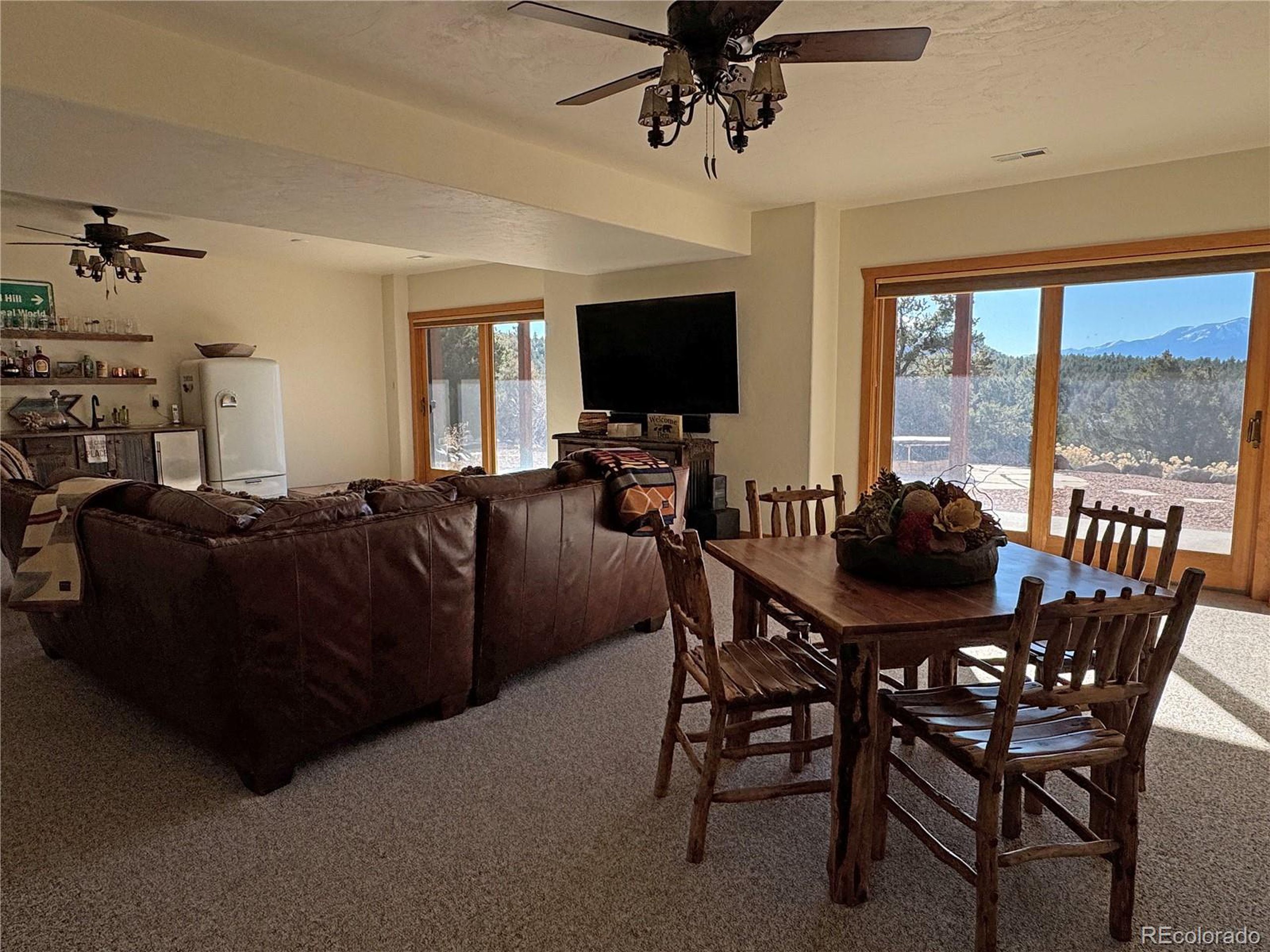 200 Moffat Road Cotopaxi, CO 81223 - Photo 14 of 42 a view of a dining room with furniture window and outside view