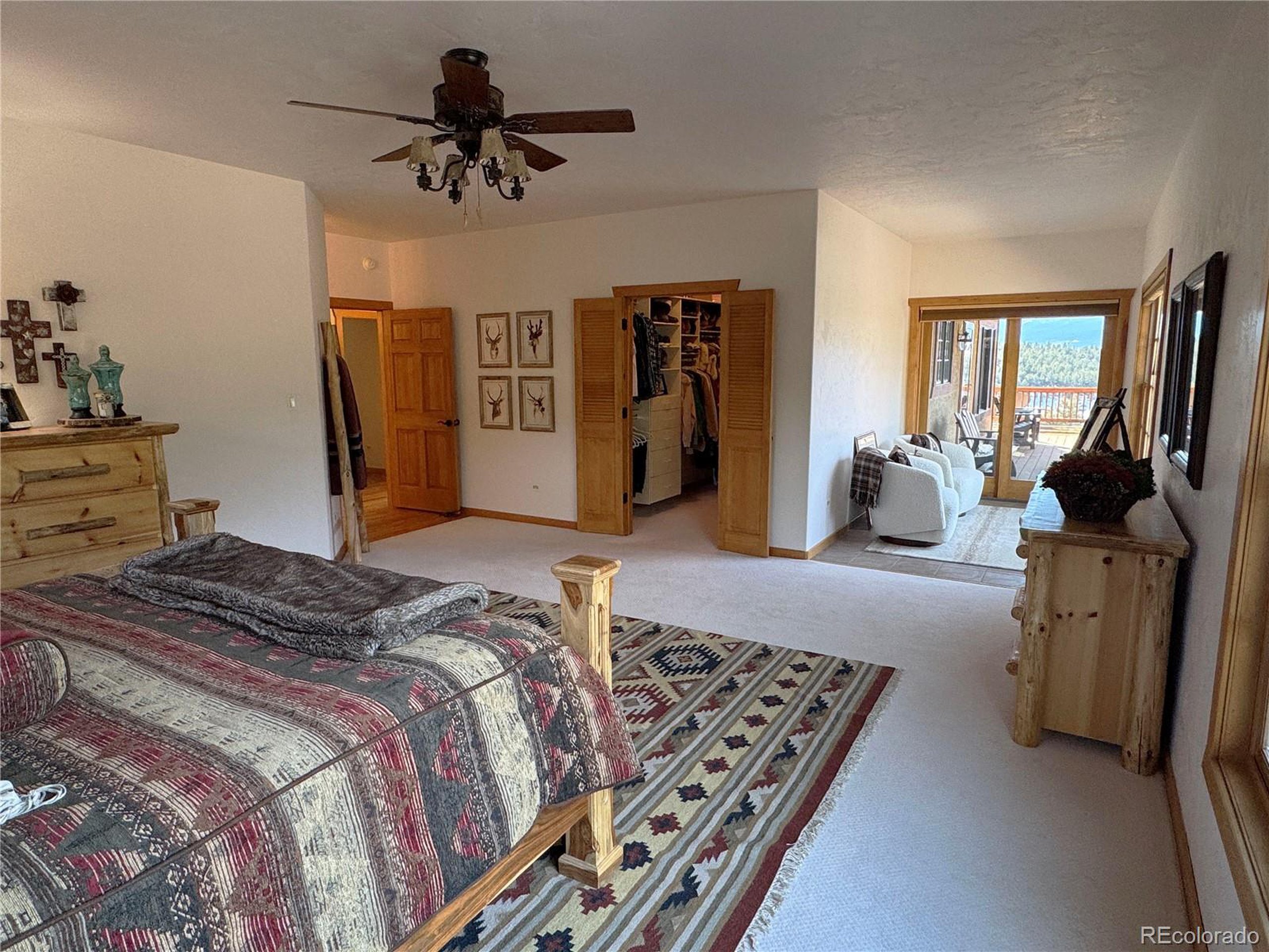 200 Moffat Road Cotopaxi, CO 81223 - Photo 8 of 42 a bedroom with bed and wooden floor