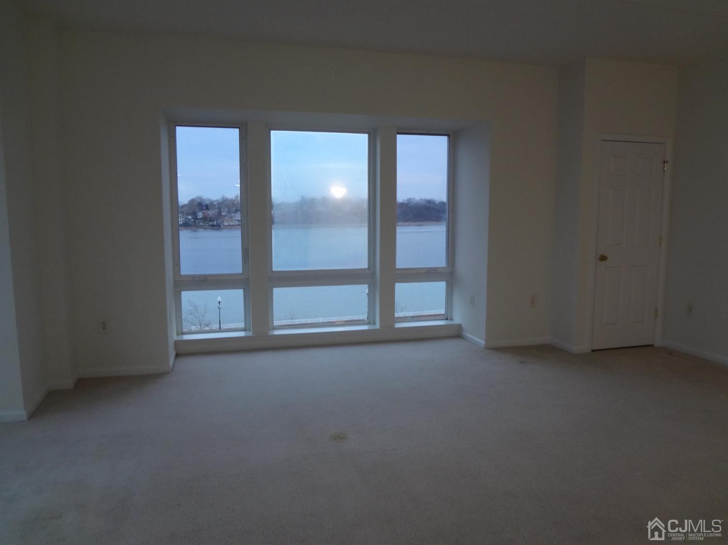 358 Rector Street, Unit 511 Perth Amboy, NJ 08861 - Photo 14 of 29 an empty room with windows