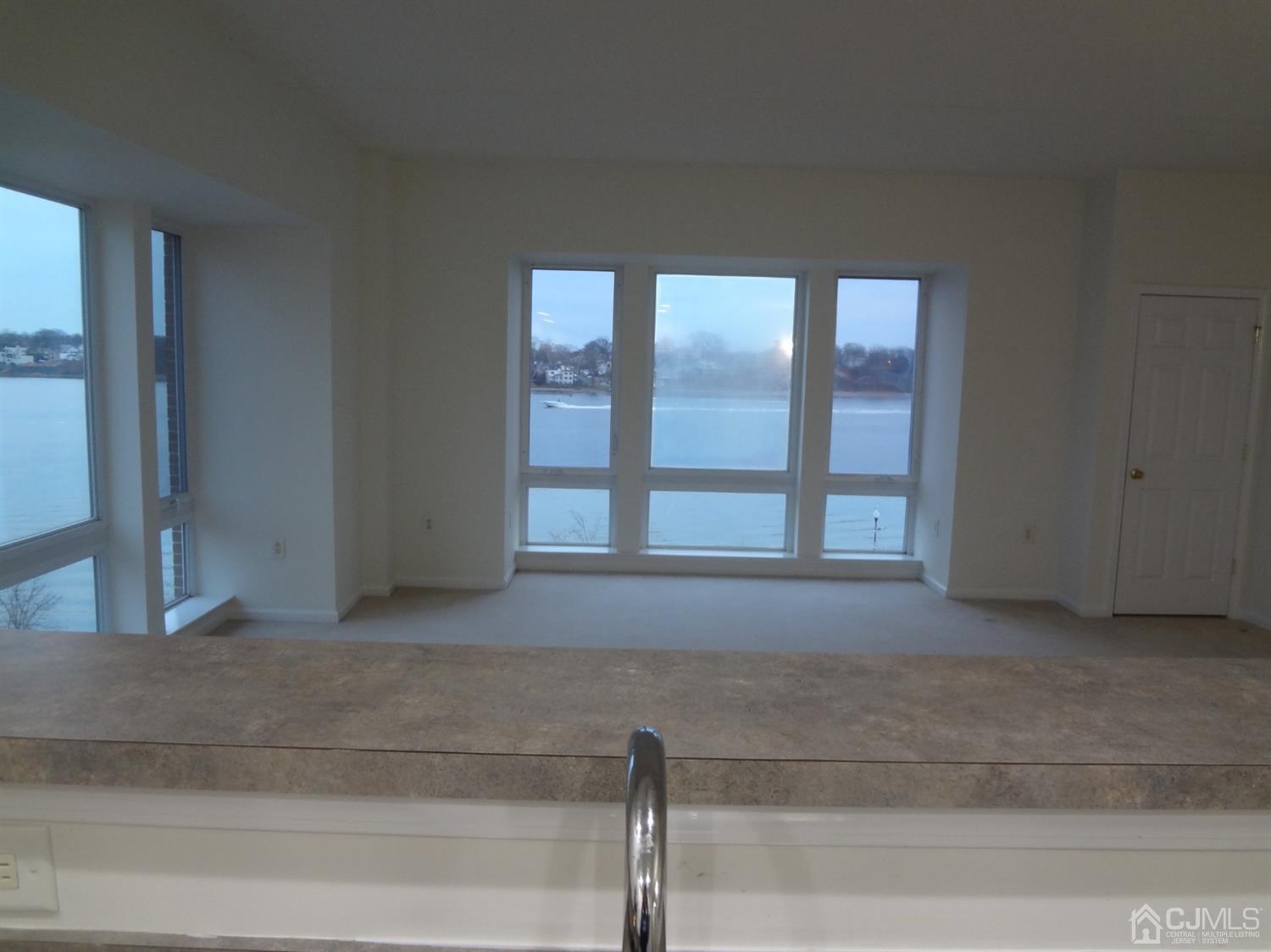 358 Rector Street, Unit 511 Perth Amboy, NJ 08861 - Photo 16 of 29 a living room with a balcony