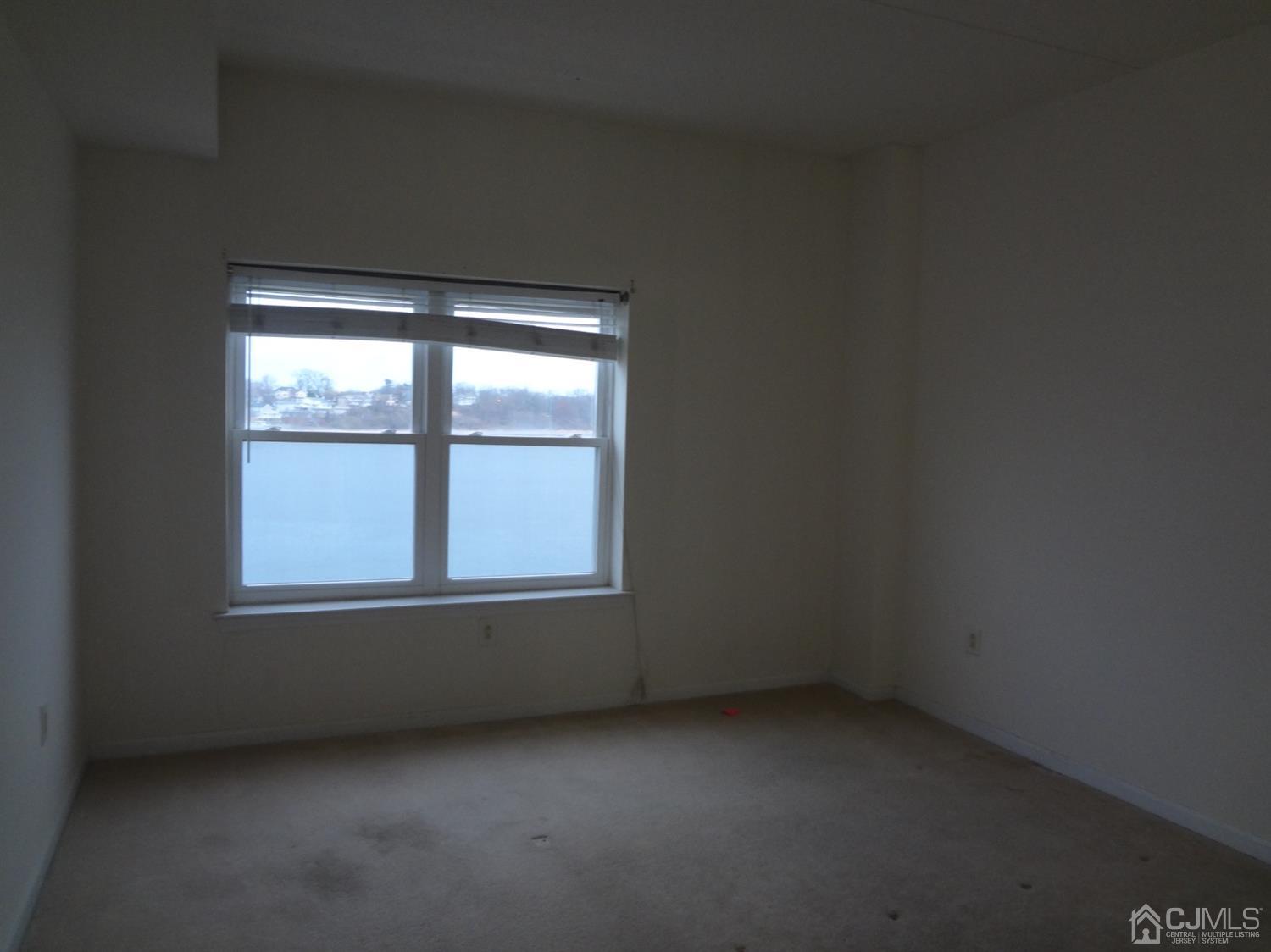 358 Rector Street, Unit 511 Perth Amboy, NJ 08861 - Photo 18 of 29 an empty room with a window