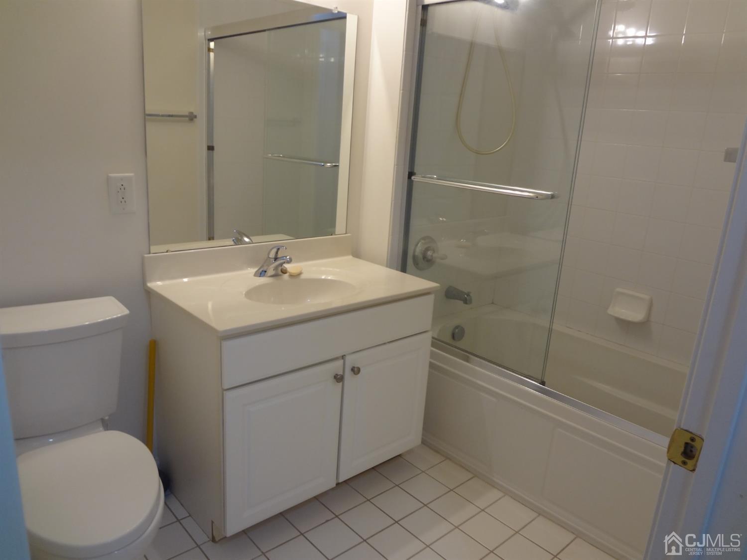 358 Rector Street, Unit 511 Perth Amboy, NJ 08861 - Photo 23 of 29 a bathroom with a sink a toilet and shower