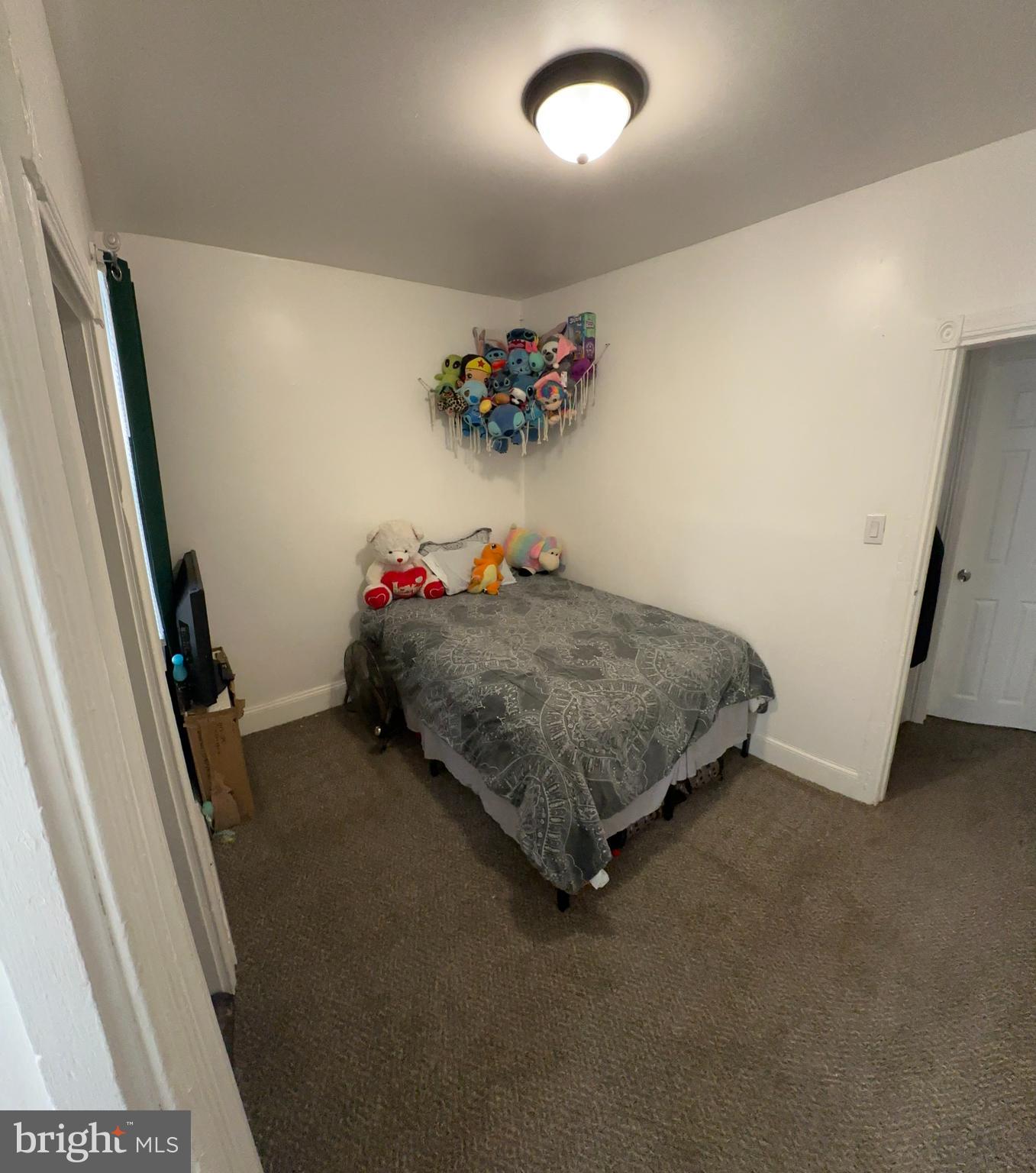 2715 Hope Street Philadelphia, PA 19133 - Photo 14 of 15 a bedroom with a bed and a dresser