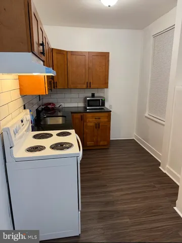 a view of kitchen and wooden floor