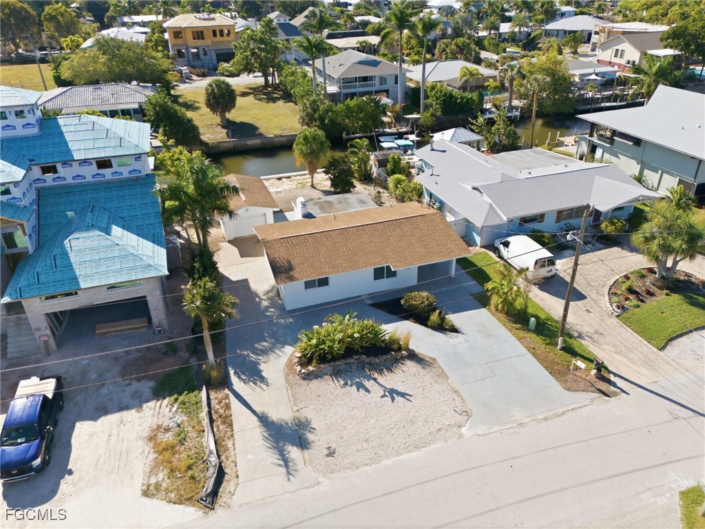 2754 Shoreview Drive Naples, FL 34112 - Photo 15 of 18 an aerial view of a house with a yard