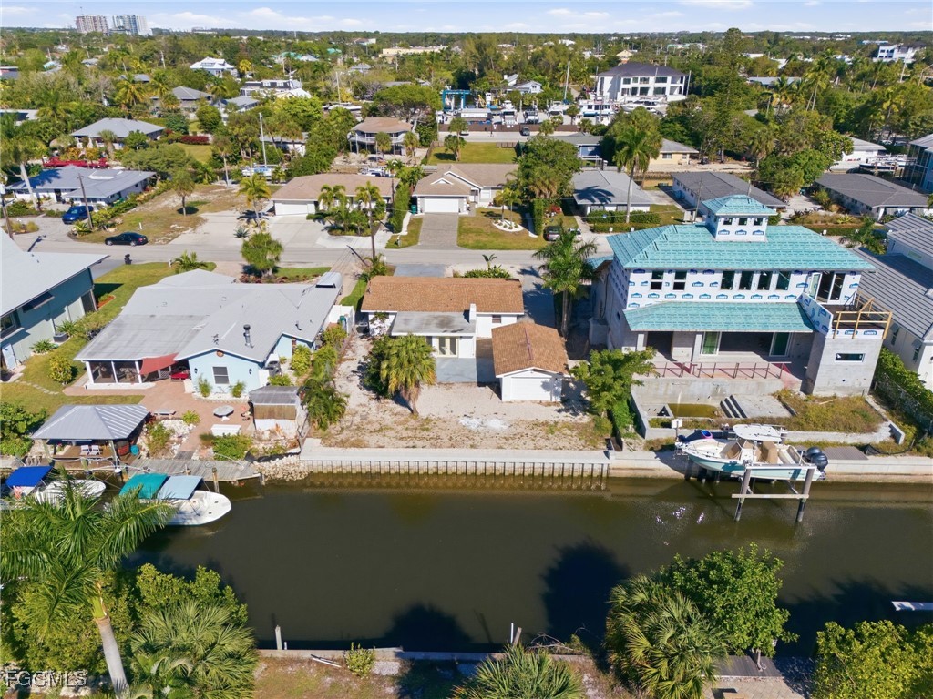 2754 Shoreview Drive Naples, FL 34112 - Photo 17 of 18 an aerial view of residential houses with outdoor space