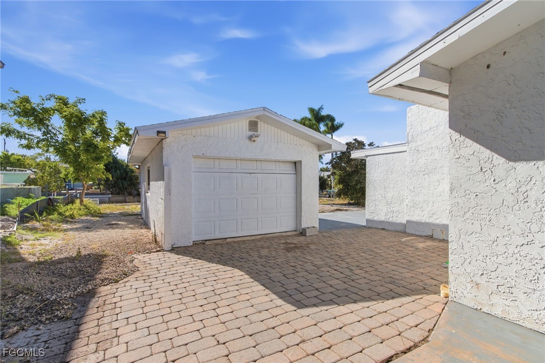 2754 Shoreview Drive Naples, FL 34112 - Photo 8 of 18 a view of a house with a yard