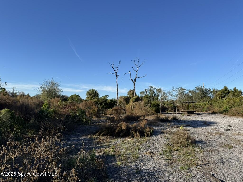 4865 Sand Point Road Grant, FL 32949 - Photo 11 of 18 a view of a town with mountains in the background