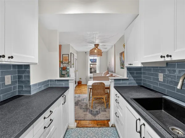 a kitchen with stainless steel appliances granite countertop a sink and stove