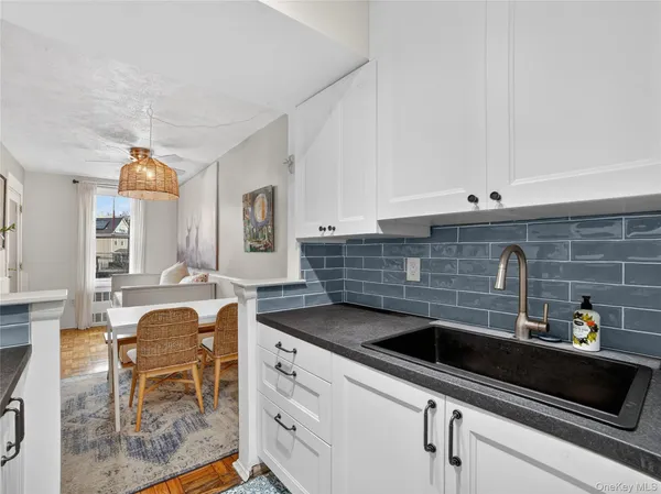 a kitchen with stainless steel appliances granite countertop a sink and cabinets