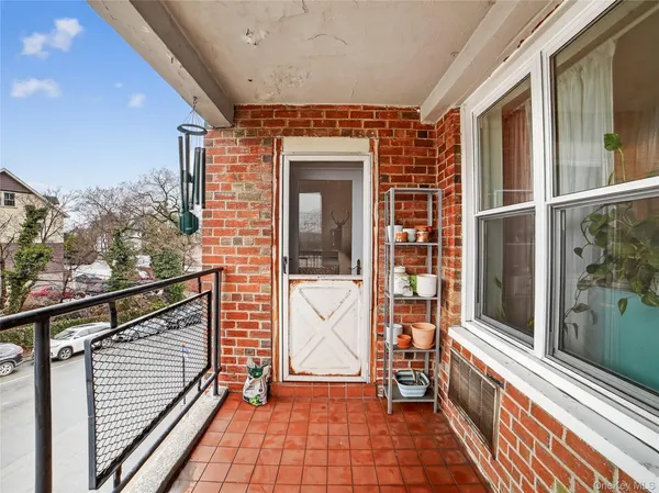 a view of front door of house with stairs