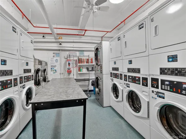 a view of a storage & utility room with washer and dryer