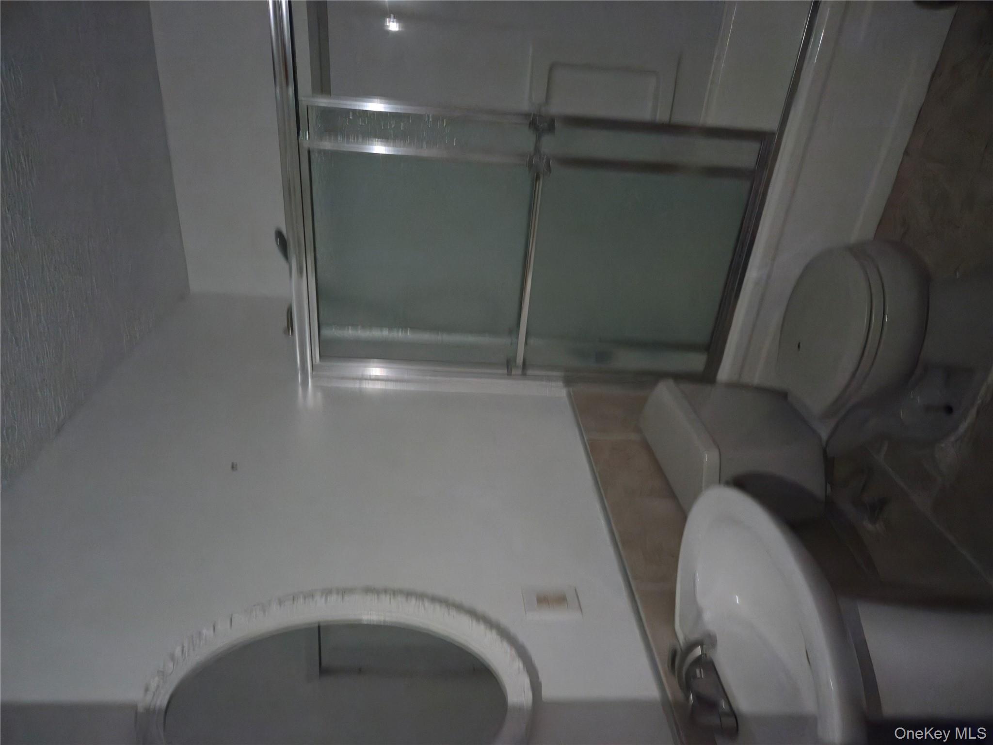 43 Glenmere Homesites Road Florida, NY 10921 - Photo 14 of 30 Full bathroom featuring shower / bath combination with glass door, tile walls, a textured ceiling, and a wainscoted wall