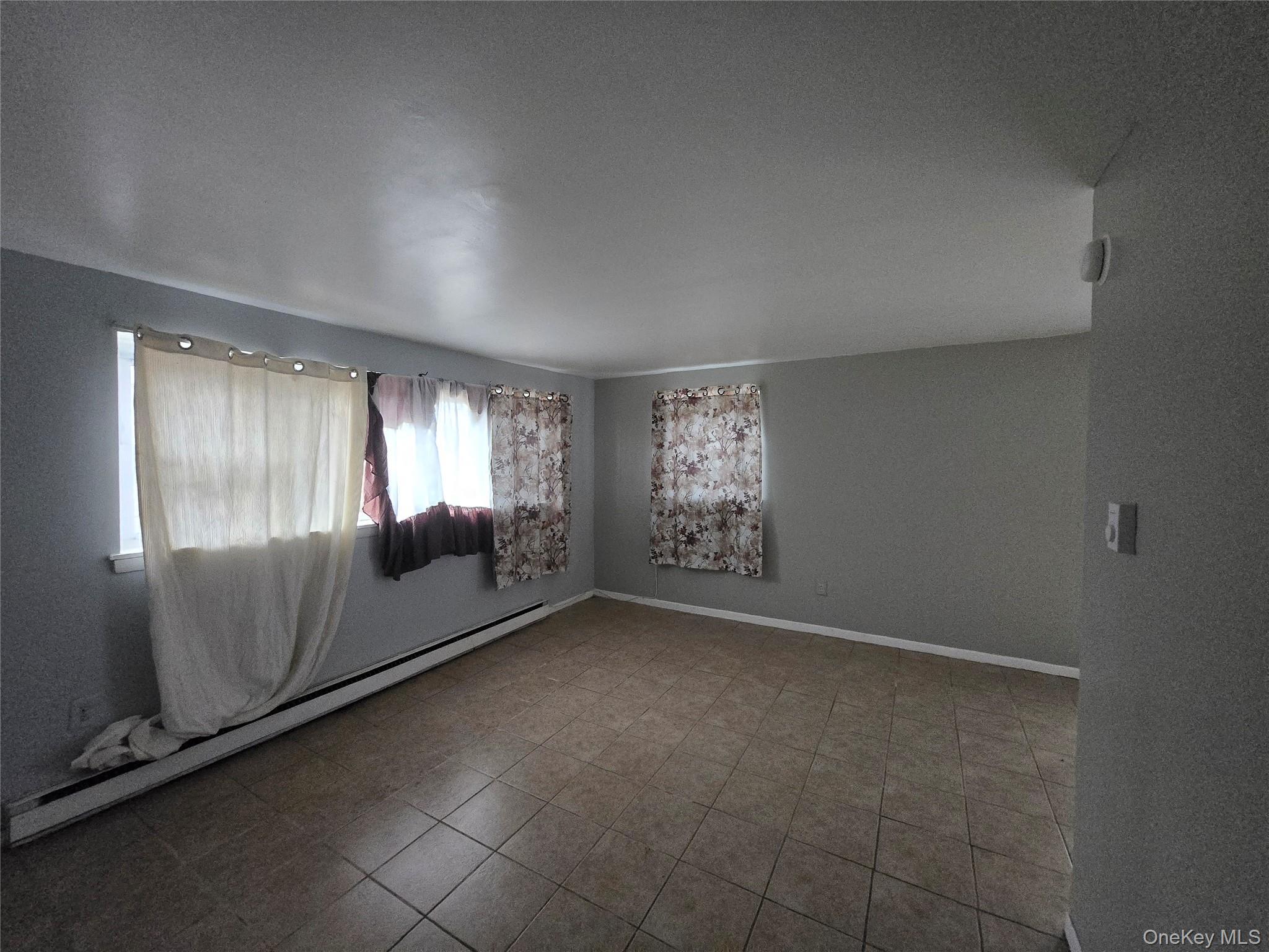 43 Glenmere Homesites Road Florida, NY 10921 - Photo 18 of 30 Spare room with a baseboard radiator and light tile patterned floors