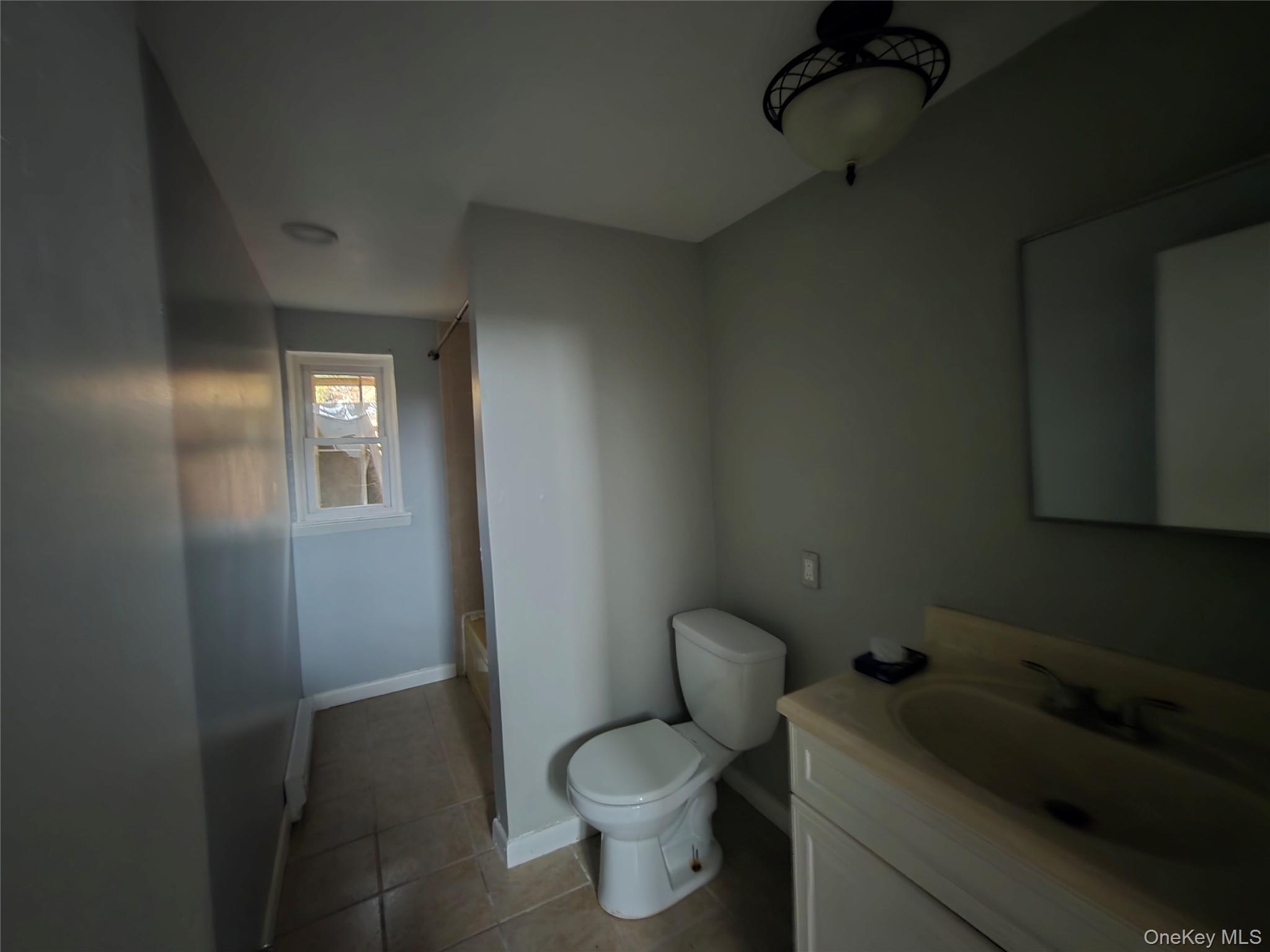 43 Glenmere Homesites Road Florida, NY 10921 - Photo 19 of 30 Full bathroom with vanity, light tile patterned flooring, and tub / shower combination