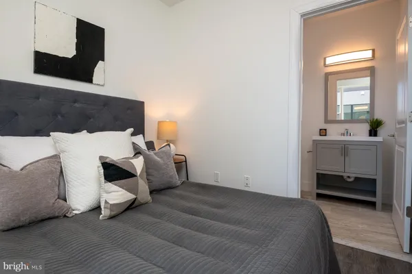 a bedroom with furniture and window