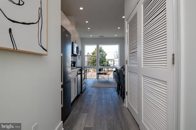 a view of a kitchen from the hallway