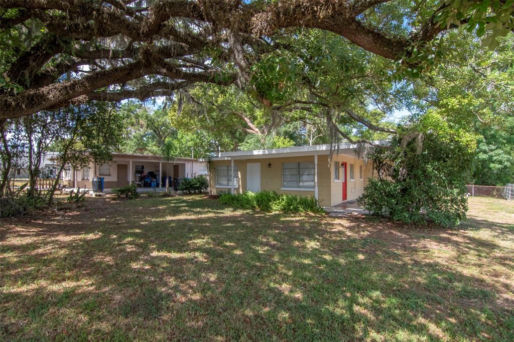126 Kingsway Road Brandon, FL 33510 - Photo 41 of 42 a view of a house with a tree in a yard