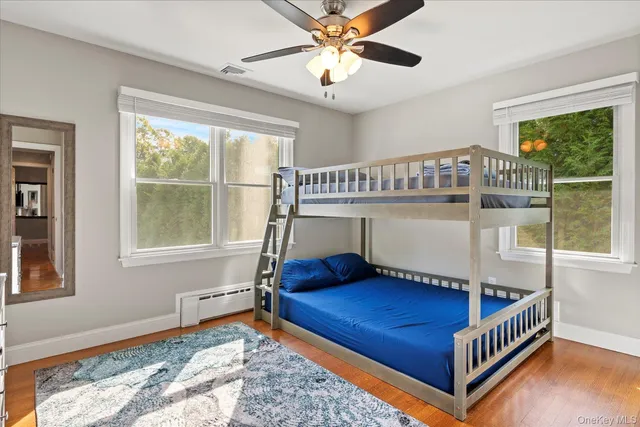 a bedroom with furniture and a window