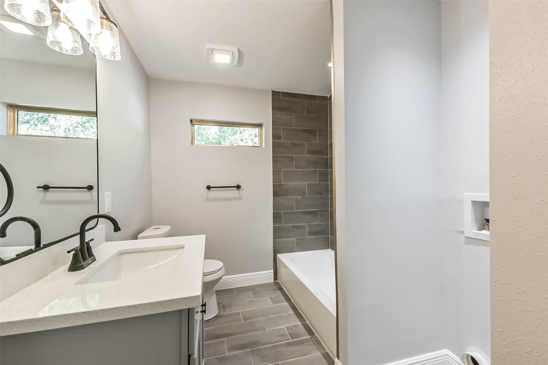 8925 Everglade Drive Houston, TX 77078 - Photo 26 of 31 a bathroom with a sink and a mirror