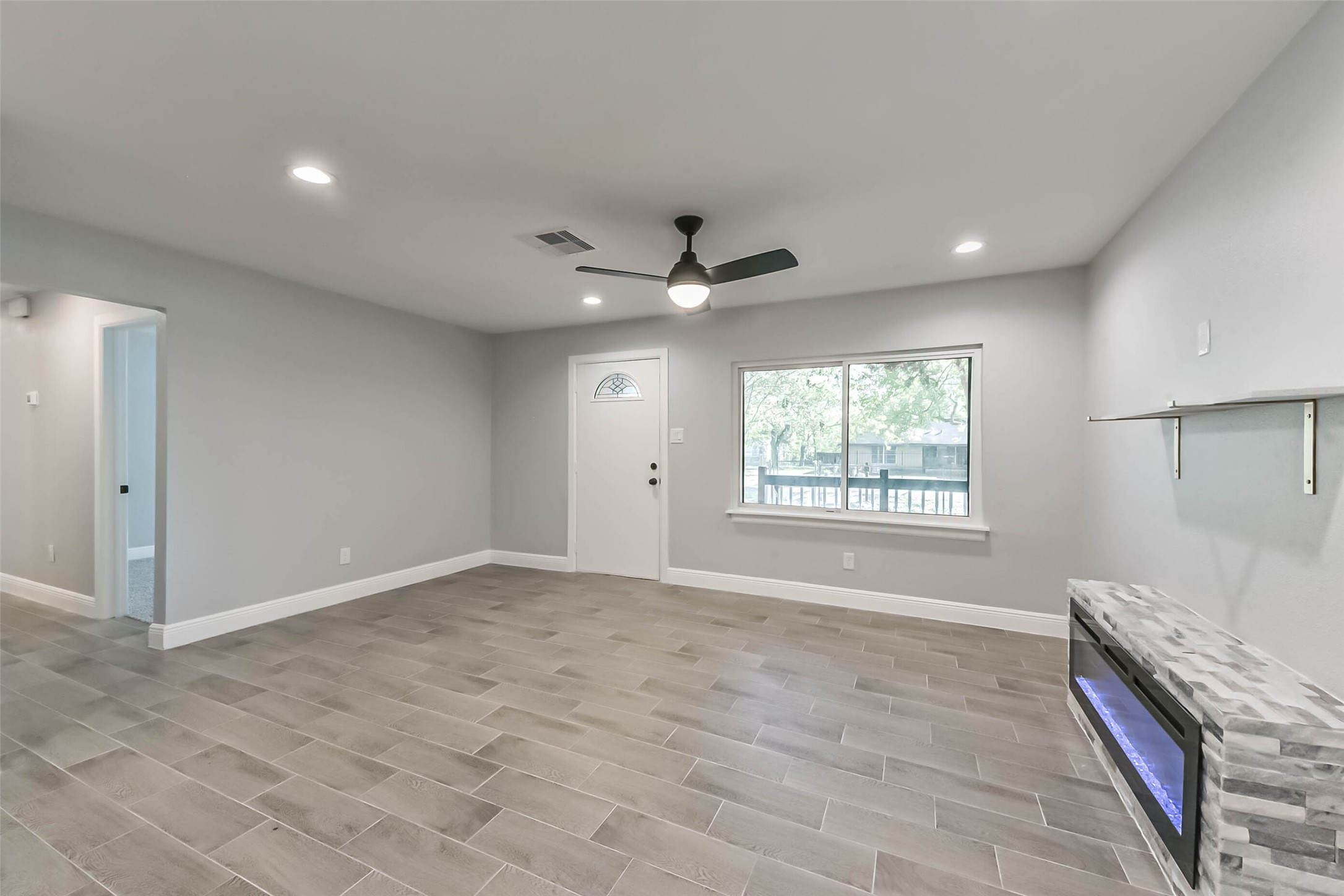 8925 Everglade Drive Houston, TX 77078 - Photo 4 of 31 a view of an empty room with a window