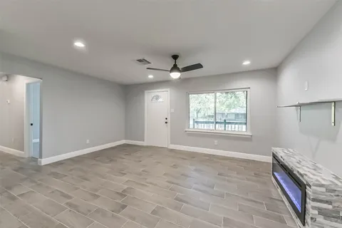 a view of an empty room with a window