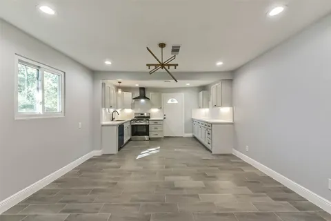 a view of a livingroom with a furniture and a ceiling fan