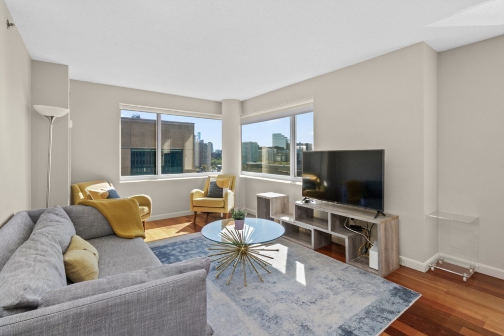 10 Museum Way, Unit 1322 Cambridge, MA 02141 - Photo 1 of 30 a living room with furniture and a flat screen tv