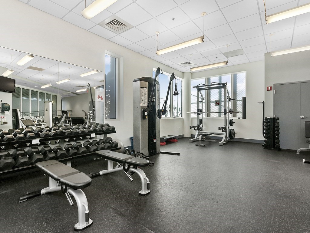 10 Museum Way, Unit 1322 Cambridge, MA 02141 - Photo 21 of 30 a room with gym equipment and a large window