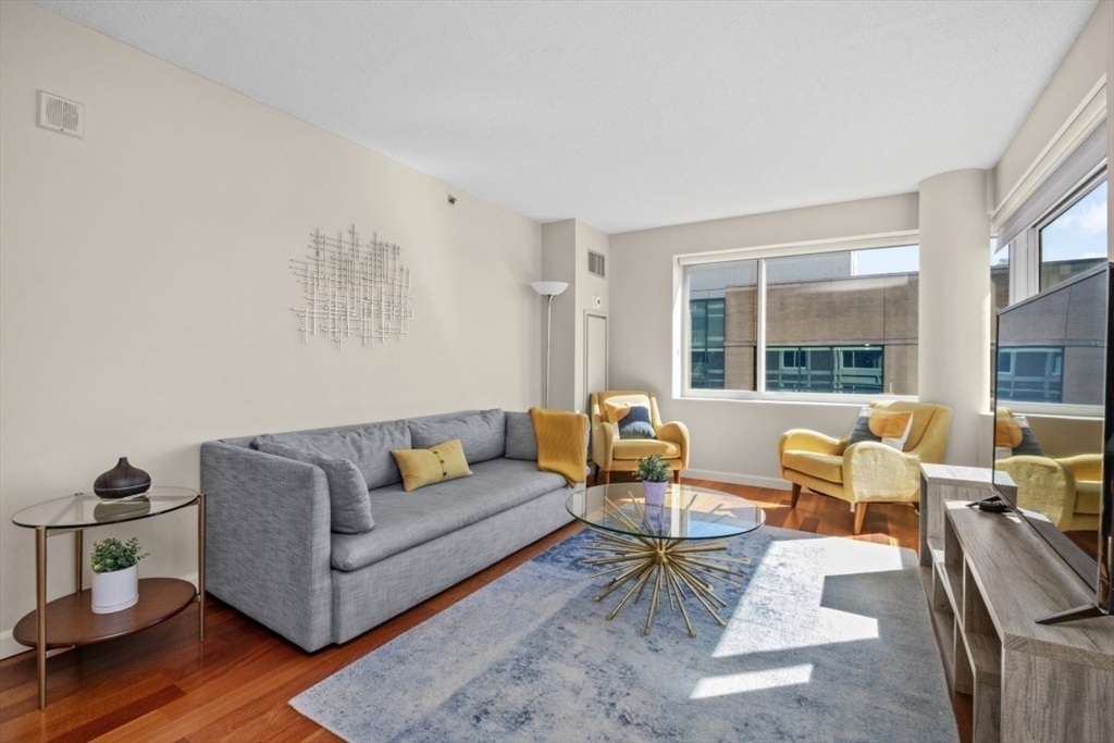 10 Museum Way, Unit 1322 Cambridge, MA 02141 - Photo 4 of 30 a living room with furniture and a large window
