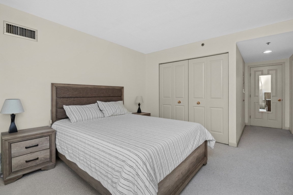 10 Museum Way, Unit 1322 Cambridge, MA 02141 - Photo 9 of 30 a bedroom with a bed and a view of bathroom