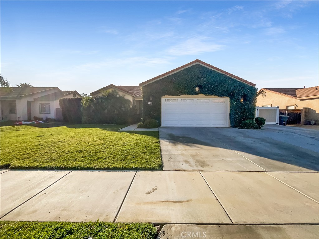 3429 Catalina Avenue Hemet, CA 92545 - Photo 1 of 20 a front view of a house with a yard and garage