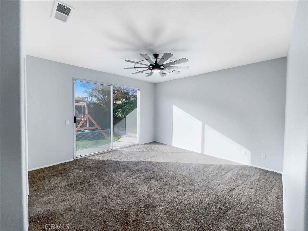 3429 Catalina Avenue Hemet, CA 92545 - Photo 15 of 20 a view of a livingroom with a ceiling fan and window