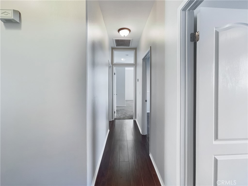 3429 Catalina Avenue Hemet, CA 92545 - Photo 17 of 20 a view of a hallway with wooden floor