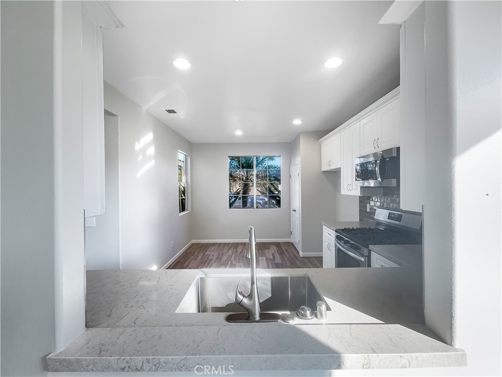 3429 Catalina Avenue Hemet, CA 92545 - Photo 18 of 20 a view of a living room with a fireplace