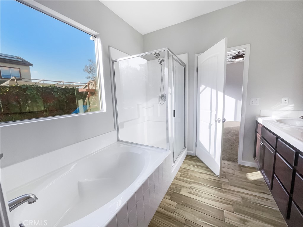 3429 Catalina Avenue Hemet, CA 92545 - Photo 9 of 20 a bathroom with a tub shower and sink