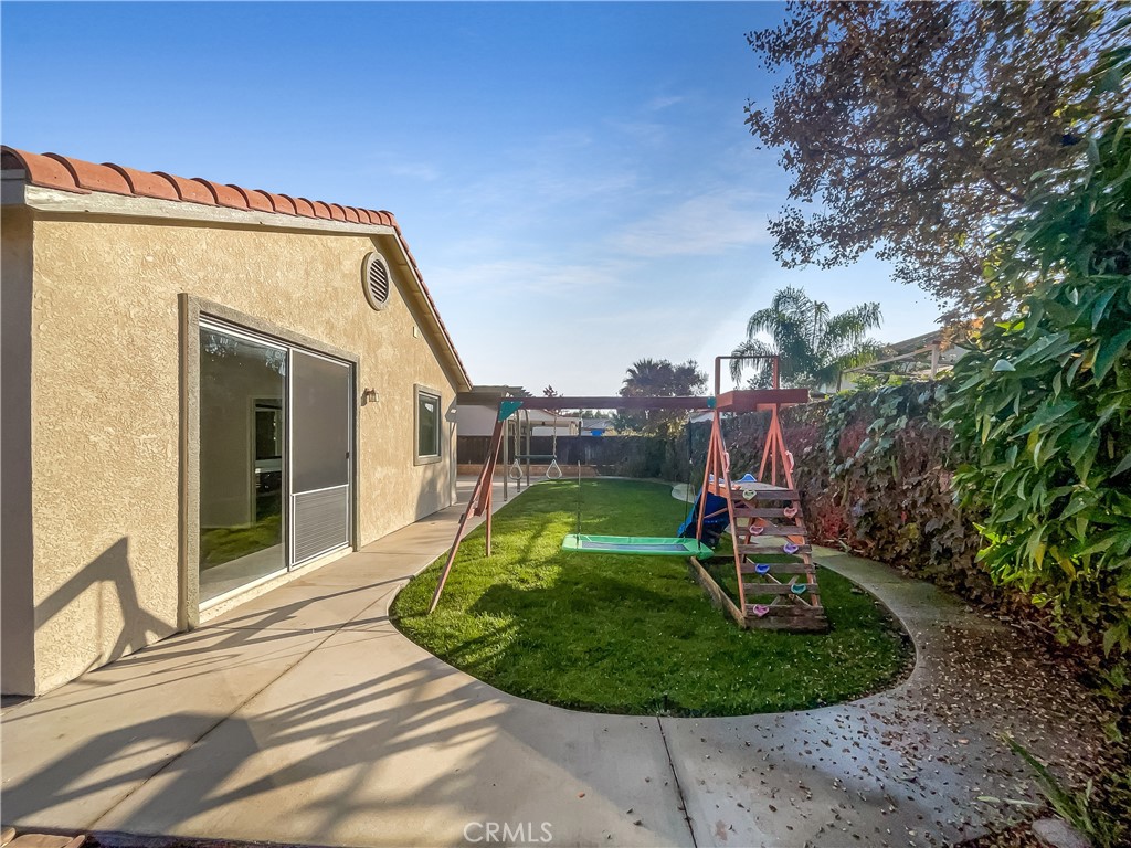 3429 Catalina Avenue Hemet, CA 92545 - Photo 10 of 20 a view of a house with a backyard porch and sitting area